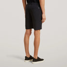 Black tech travel shorts side view, knee-length straight leg with belt loops