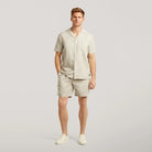 Light sand linen-cotton open collar short-sleeve shirt on model