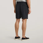 Mens drawstring shorts shown from back with elastic waist and back seam