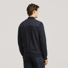 Hybrid bomber jacket back view on model, ribbed hem and cuffs, dark navy