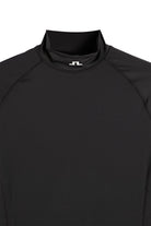Black compression mock-neck top with small chest logo at neckline.