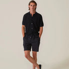 Mens deep navy drawstring shorts with elastic waist and knee-length hemline