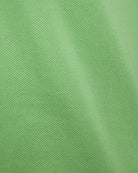 Green knit polo fabric close-up
