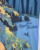 T-shirt close-up of 'love' and Sergio Tacchini text with sailboat graphic.