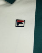 Polo logo patch on white knit fabric.