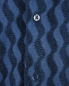 Blue jacquard short-sleeve shirt with round button and small neck logo