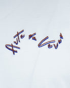 White T-shirt fabric with multicolor embroidered cursive graphic detail