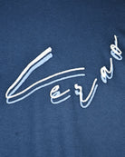 Coastal blue cotton T-shirt with close-up white embroidered script lettering