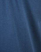 Coastal blue cotton T-shirt fabric texture close-up
