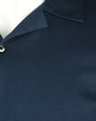 Navy Cuban shirt fabric texture near the collar seam