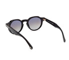 Shiny black round sunglasses angled view, tinted lenses, gold-tone accent on hinge