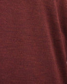 Burgundy knitted fabric swatch with fine textured knit