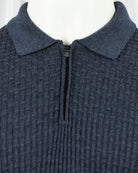 Blue textured knit polo with turn-down collar and front zip hardware