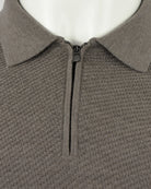 Taupe textured polo neckline with half-zip and mock collar