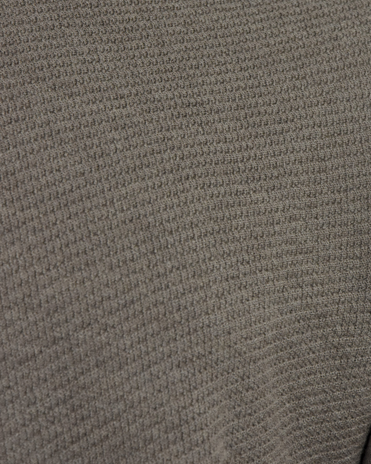 Taupe textured knit polo fabric close-up