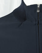 Dark navy stand collar with ribbed knit edge and smooth zip front panel