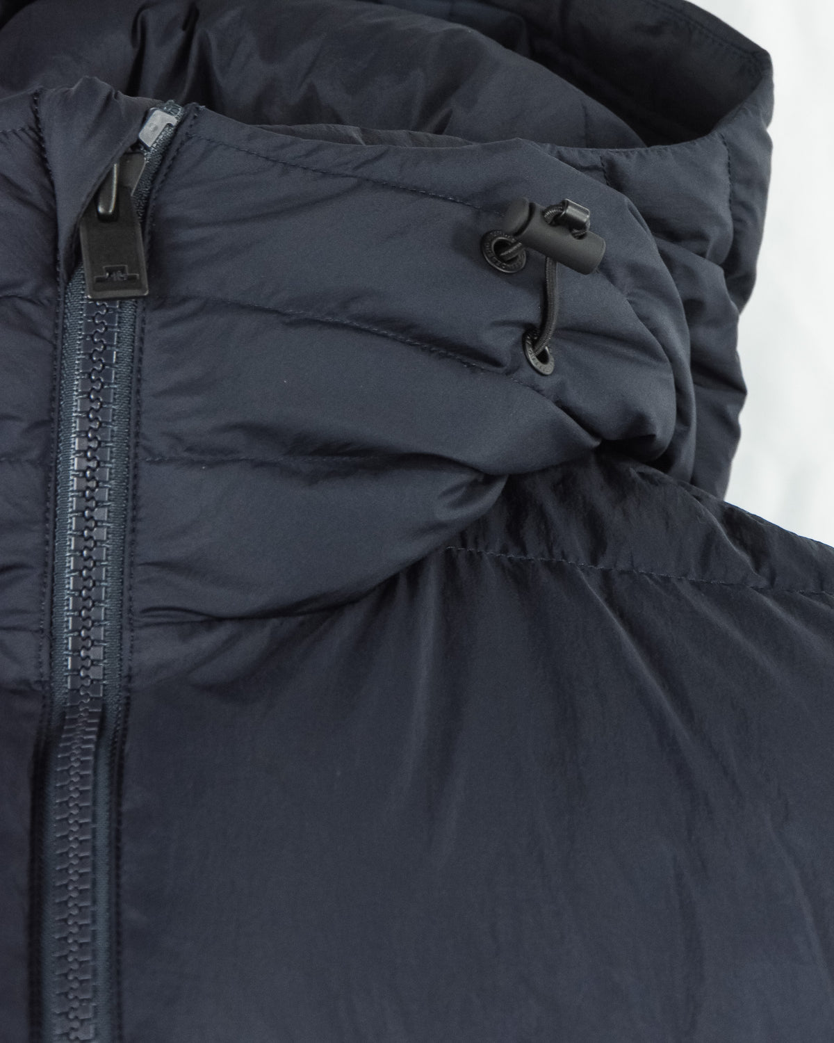 Dark navy hooded crinkle down jacket with drawcord and metal zipper pull