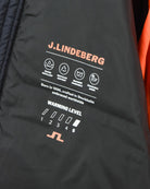 J.Lindeberg warning level graphic on dark navy down jacket