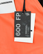 Down jacket hang tag with 6000 FP label, attached to crinkle fabric
