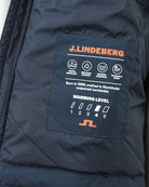 Navy down jacket interior brand patch with warmth level icons