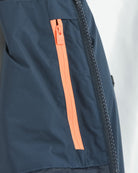 Navy down jacket close-up of zipper with orange fabric stripe