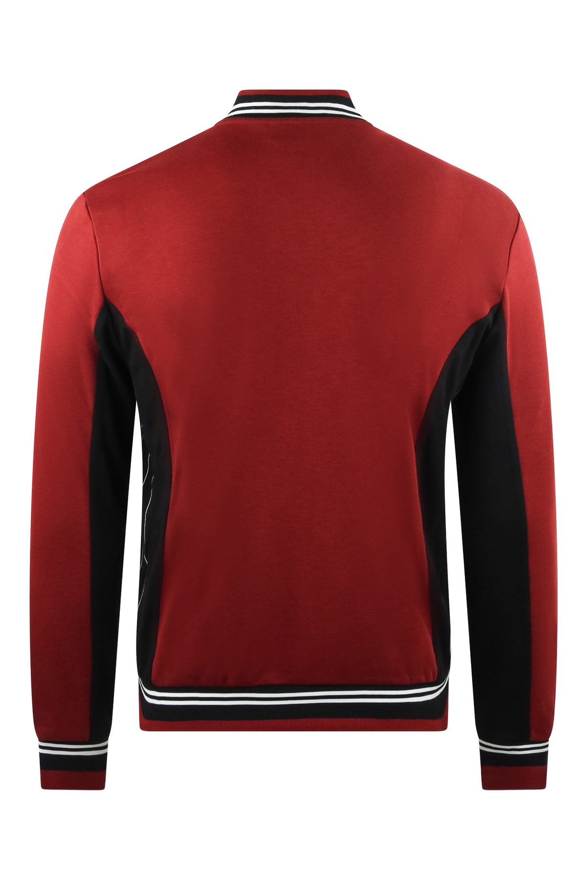 Back view red track jacket with black panels, striped rib hem, full-length zipper.