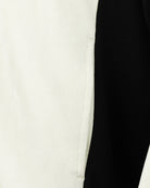 Cream baseball jacket panel with black side trim and contrast ribbed edge