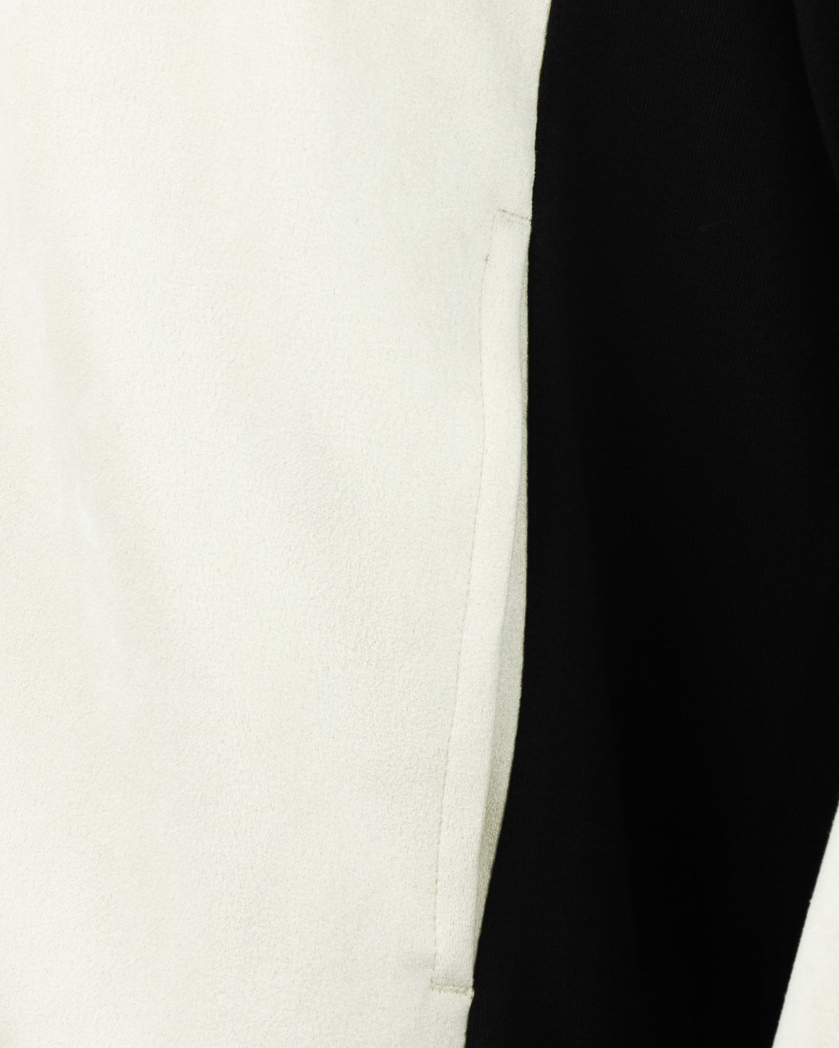 Cream baseball jacket panel with black side trim and contrast ribbed edge