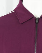Purple track jacket shoulder seam with stand collar and zipper