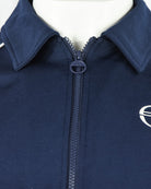 Navy track top stand collar with full zip and circular logo badge