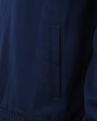 Navy track jacket with rectangular pocket flap on front