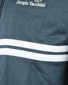 Teal track jacket with white stripe band and Sergio Tacchini logo near the hem