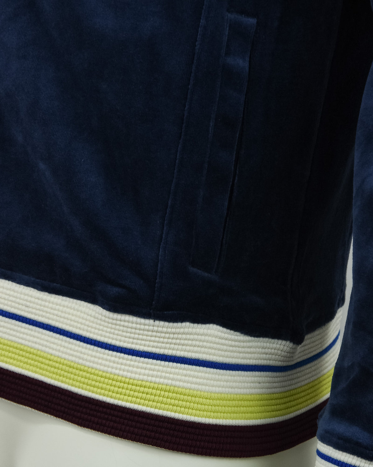 Dark blue velour track jacket with striped ribbed hem and cuff trim