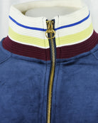 Velour track jacket collar with striped trim and gold zip pull