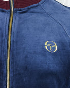 Dark blue velour track jacket with embroidered gold TT logo on chest