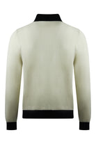 Cream knitted long-sleeve polo with ribbed black hem and cuffs.