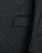 Charcoal grey overcoat fabric with flap side pocket detail