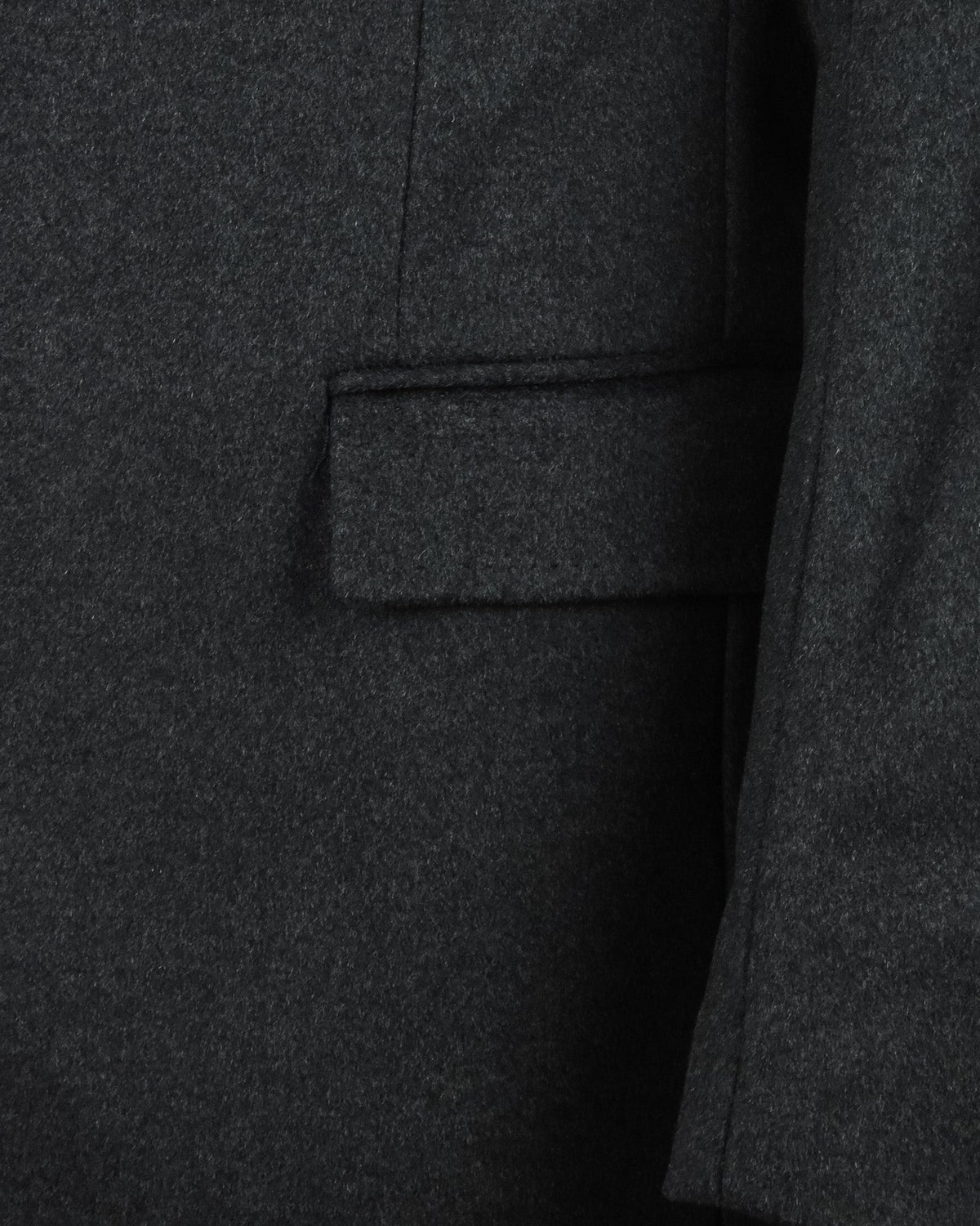 Charcoal grey overcoat fabric with flap side pocket detail