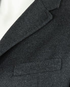 Charcoal grey overcoat lapel and welt chest pocket detail