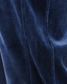 Velour track pants inner seam close-up on blue fabric