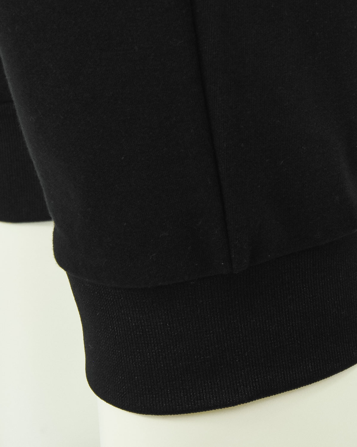 Black ribbed ankle cuff on jogger pants hem