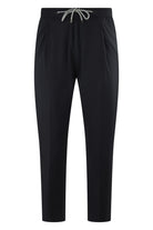 Black drawstring jersey stretch pants with elastic waistband and tapered leg