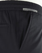 Black jersey stretch pant waistband with drawstring and inner seam detail