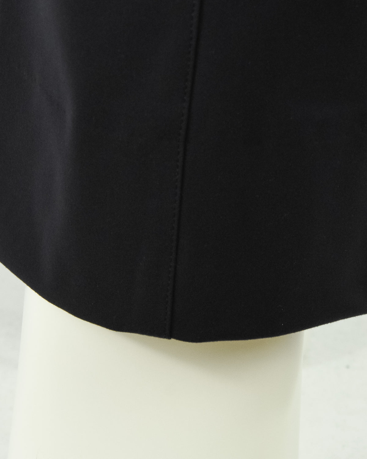 Black jersey stretch pant hem and side seam detail, cropped view