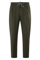 Olive drawstring jersey stretch pants with tapered legs and elastic waistband