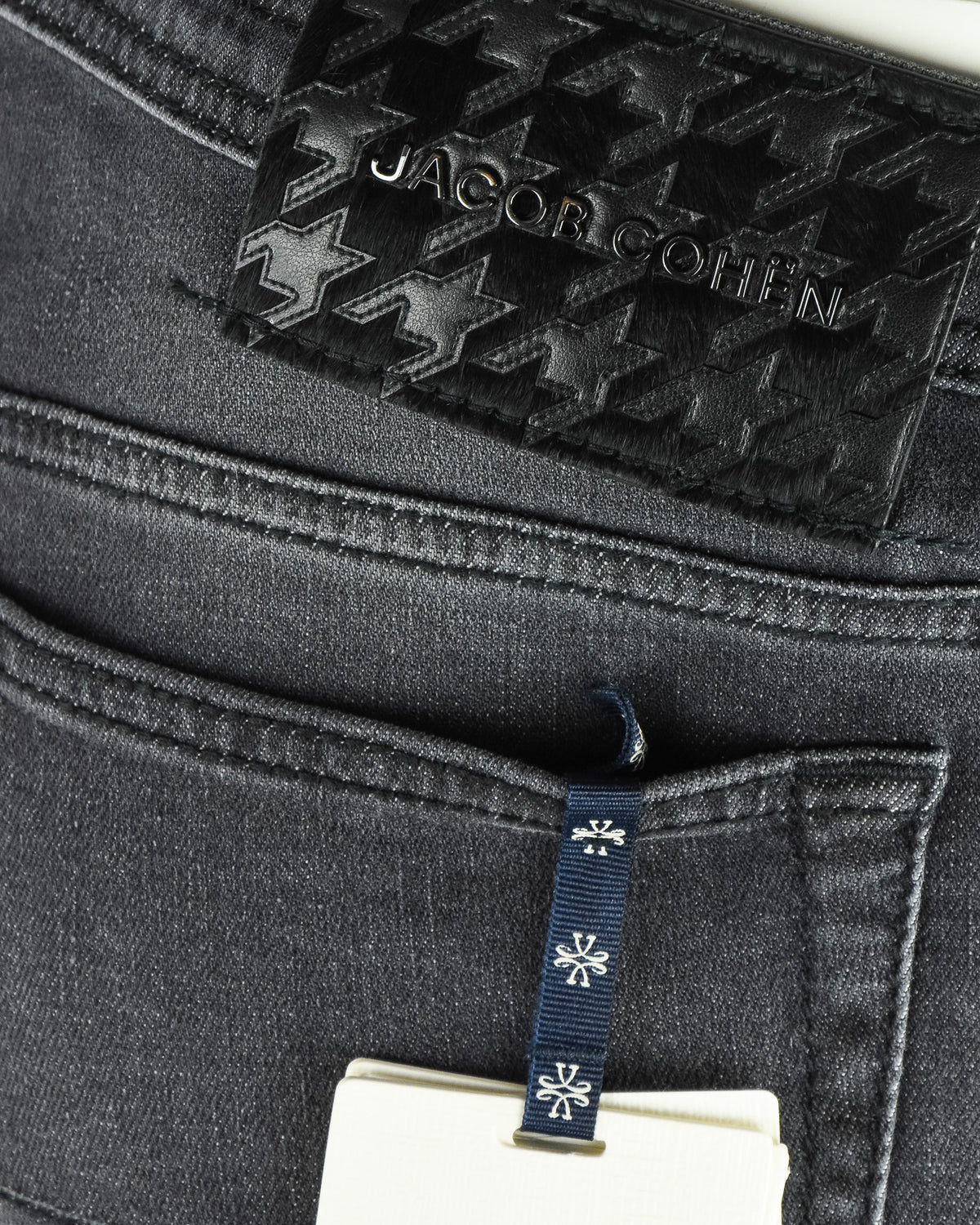 Star-pattern Jacob Cohen logo patch on dark grey jeans waistband.