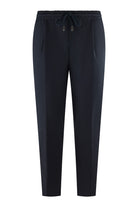 Navy drawstring tech pants with elastic waist and tapered legs