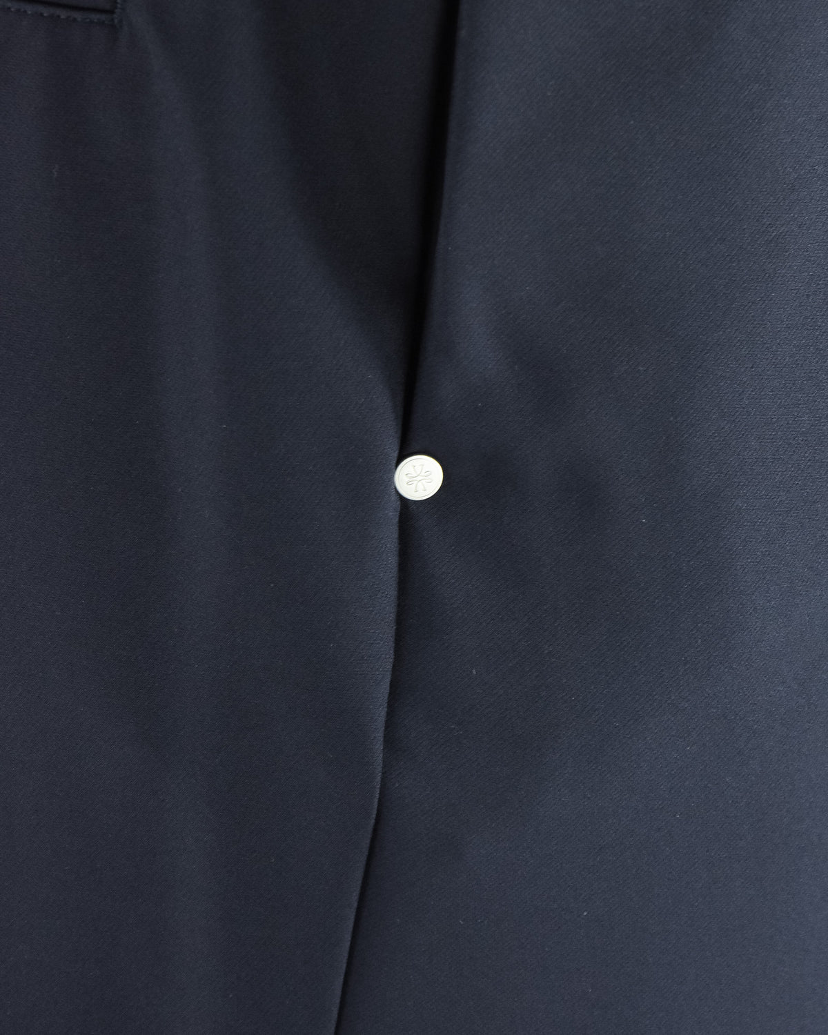 Navy tech pants with front seam and round button detail