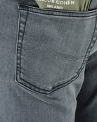 Grey denim pocket detail with curved yoke stitching and reinforced topstitch