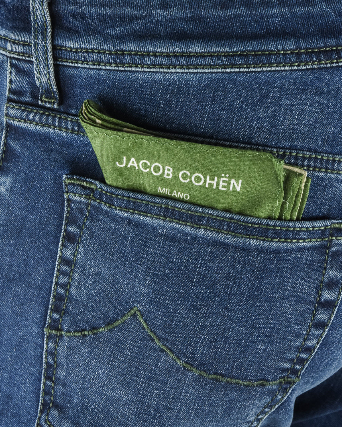 Denim waistband with green JACOB COHEN patch and contrast green topstitching.